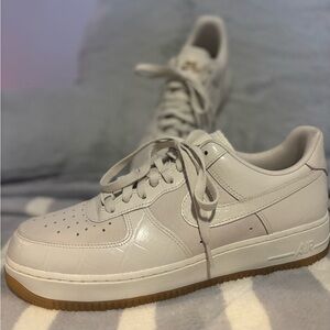 Nike White textured “snake skinned” Air Force ones with Gold Logo